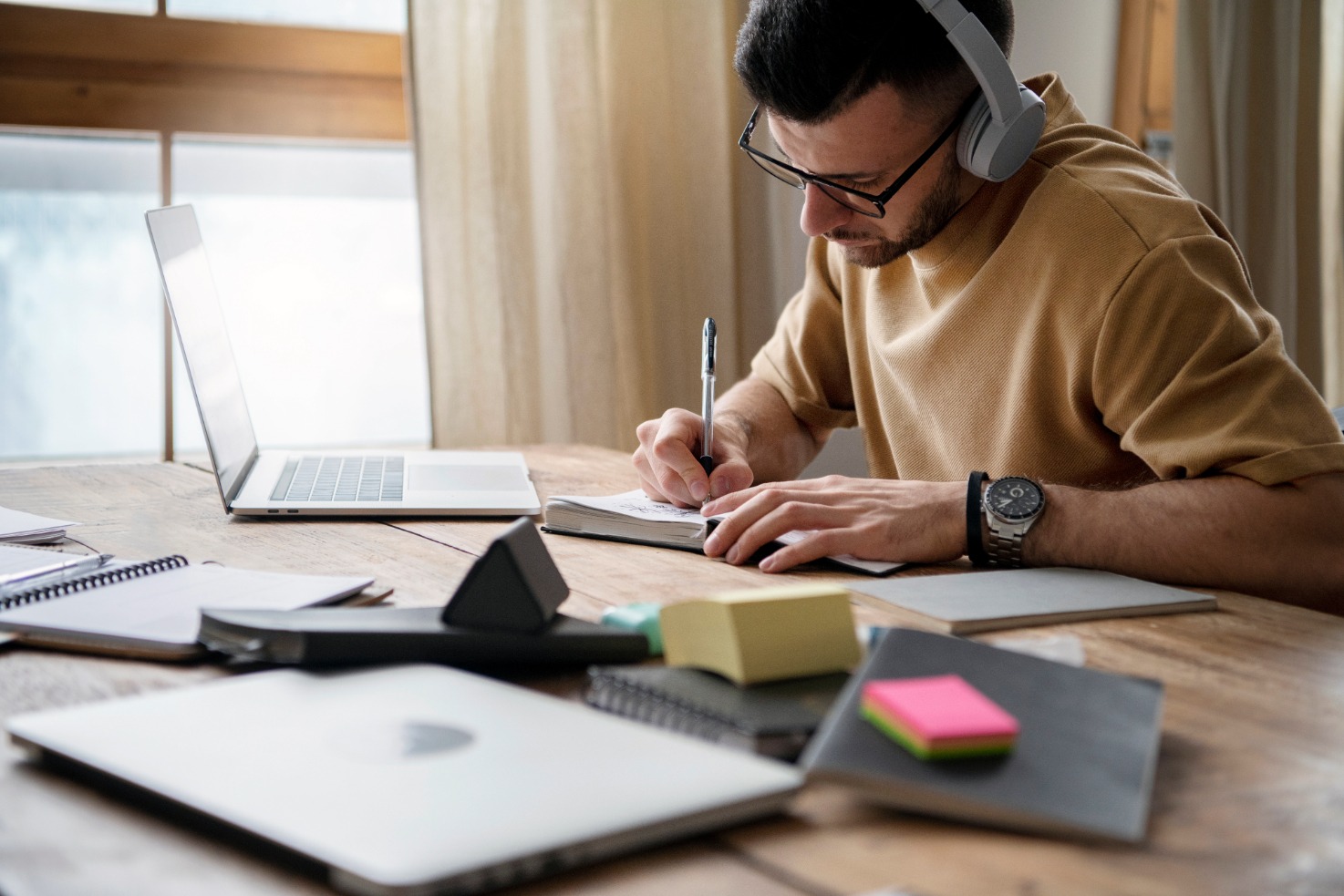 "Freelancer writing blog content from a budget workspace"