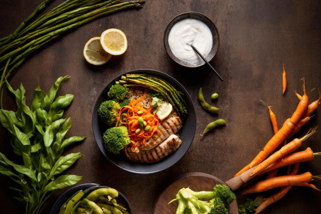 A vibrant plate of quinoa, salmon, avocado, and greens representing functional protein-rich foods for optimal health.